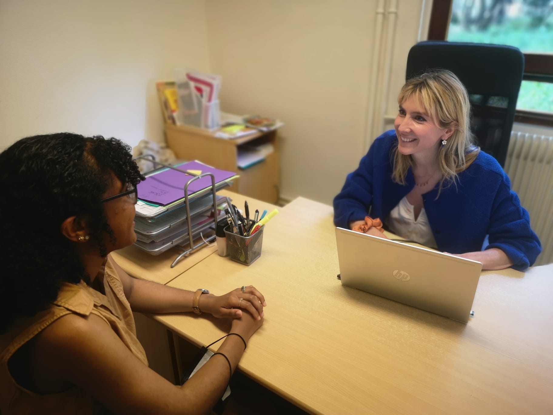 Director Aurelie Perrier and a student during advising.