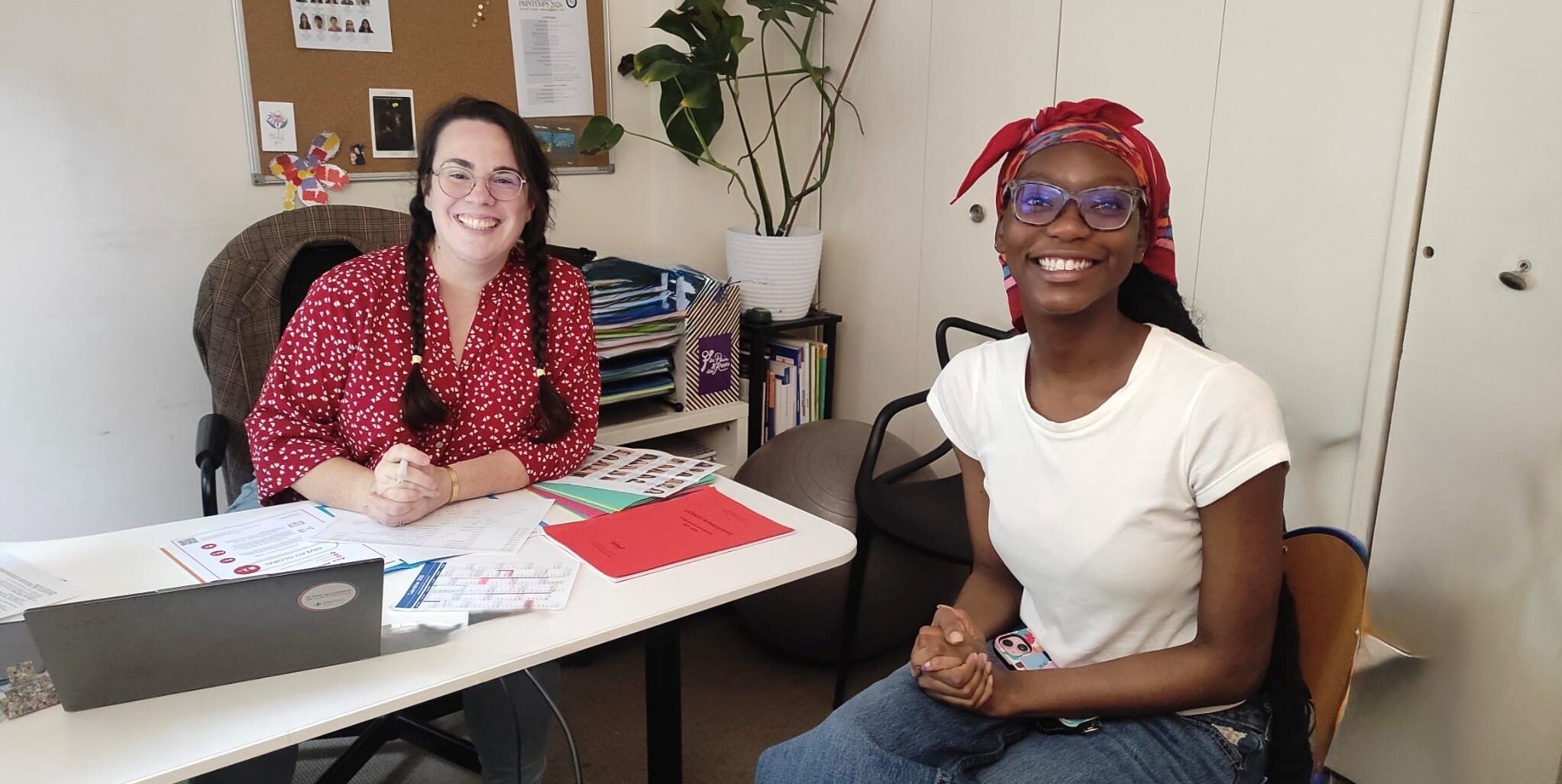 Female professor and advisor with student in APA office in Paris